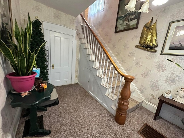 344 Main St, Lincoln, ME 04457 - stairway featuring carpet flooring, wallpapered walls, and visible vents