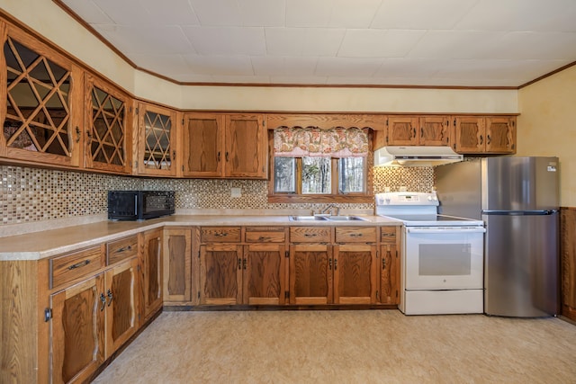 kitchen featuring brown cabinetry, crown molding, a sink, white range with electric stovetop, and under cabinet range hood