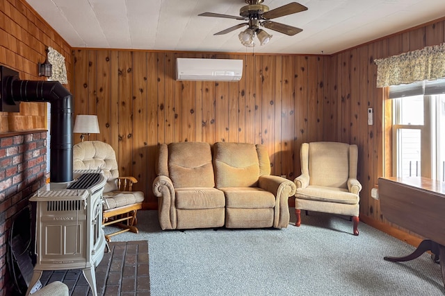 carpeted living room with a ceiling fan, wood walls, a wall mounted AC, and a wood stove