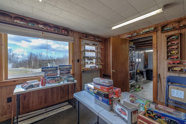 office space featuring wooden walls