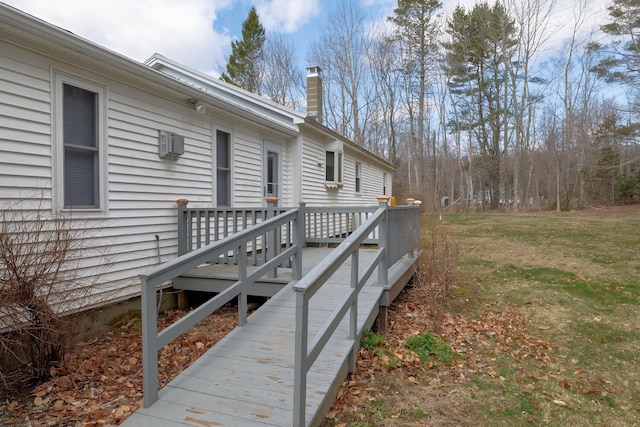 view of property exterior featuring an AC wall unit, a wooden deck, a yard, and a chimney