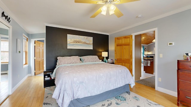 bedroom with light wood-type flooring, ornamental molding, baseboards, ceiling fan, and a baseboard radiator