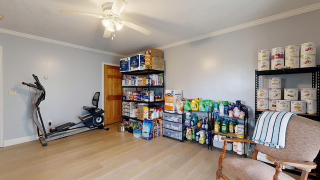 game room with light wood-style floors, ornamental molding, ceiling fan, and baseboards
