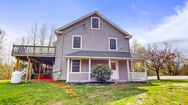 view of front of house with stairway, a front yard, a porch, and a wooden deck