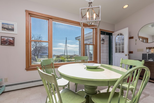 dining space featuring recessed lighting, a notable chandelier, and a healthy amount of sunlight