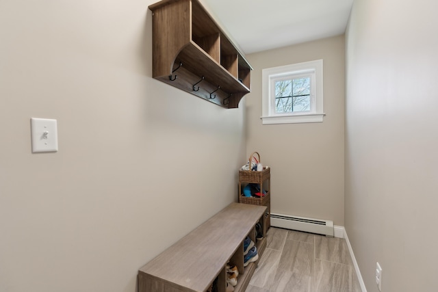 mudroom featuring baseboards and a baseboard heating unit