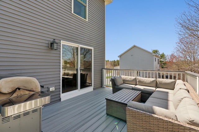 deck with grilling area and an outdoor hangout area