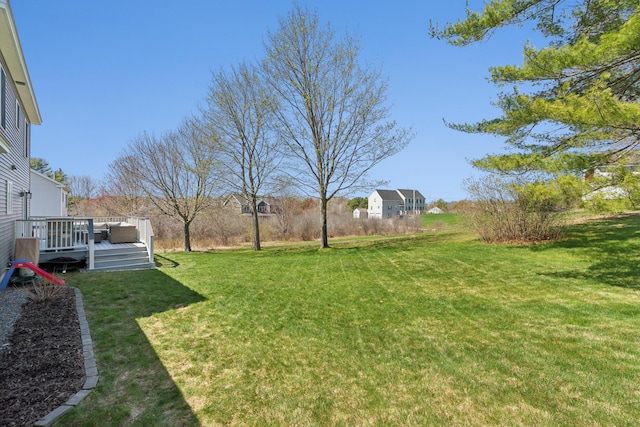 view of yard featuring a wooden deck