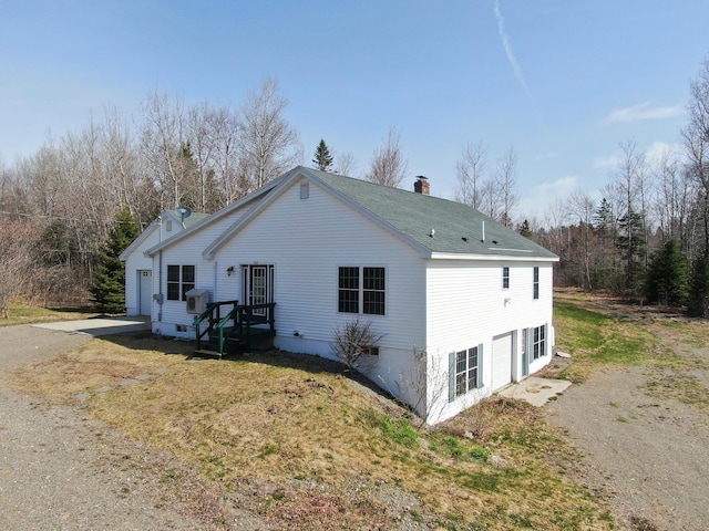 242 Bottle Lake Rd, Springfield, ME 04487 - back of property with a lawn, a chimney, and roof with shingles
