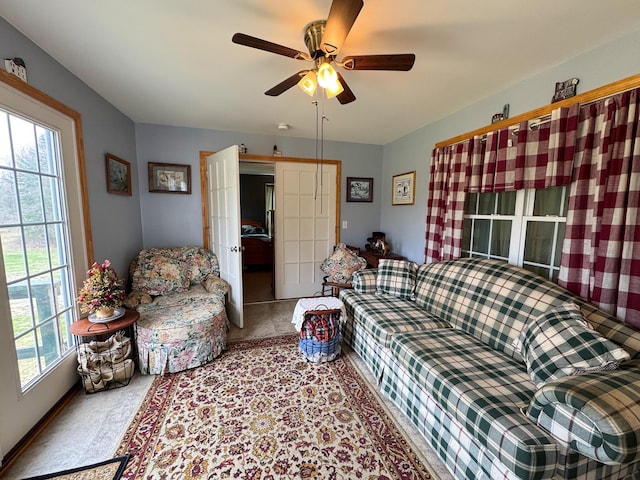 242 Bottle Lake Rd, Springfield, ME 04487 - carpeted living area with french doors and a ceiling fan