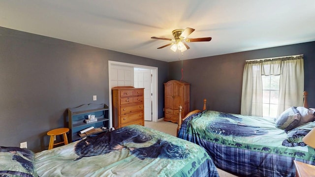 242 Bottle Lake Rd, Springfield, ME 04487 - bedroom with light colored carpet and a ceiling fan
