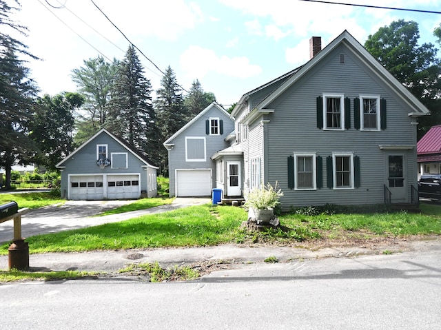 12 Preble St, Bingham, ME 04920 - traditional home featuring a chimney and a garage
