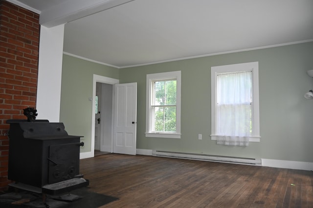 12 Preble St, Bingham, ME 04920 - unfurnished living room featuring a baseboard radiator, a wood stove, wood finished floors, and crown molding