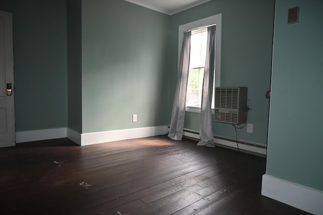 12 Preble St, Bingham, ME 04920 - spare room featuring wood-type flooring, a wall mounted AC, ornamental molding, and a baseboard radiator