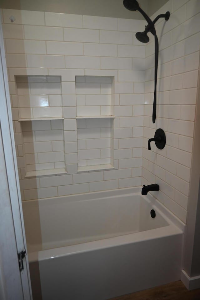 12 Preble St, Bingham, ME 04920 - full bathroom with washtub / shower combination and wood finished floors
