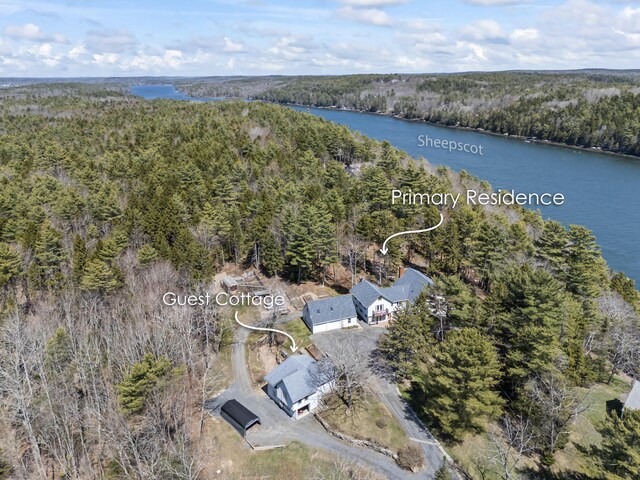 aerial view with a water view and a view of trees
