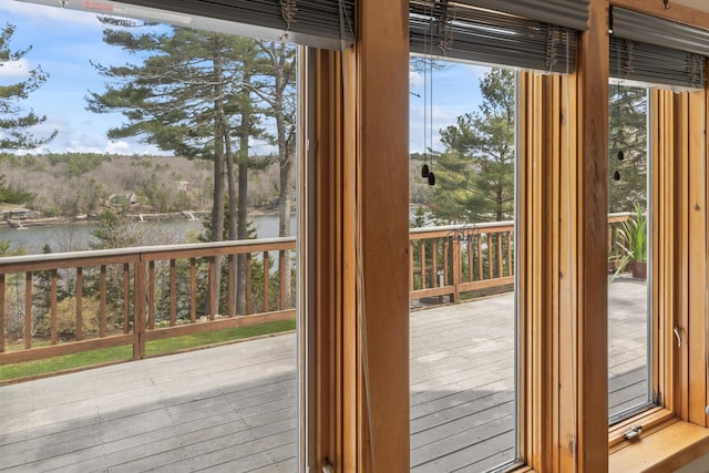 doorway to outside with a water view