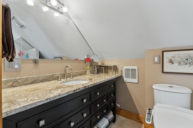 bathroom featuring visible vents, vanity, baseboards, toilet, and lofted ceiling