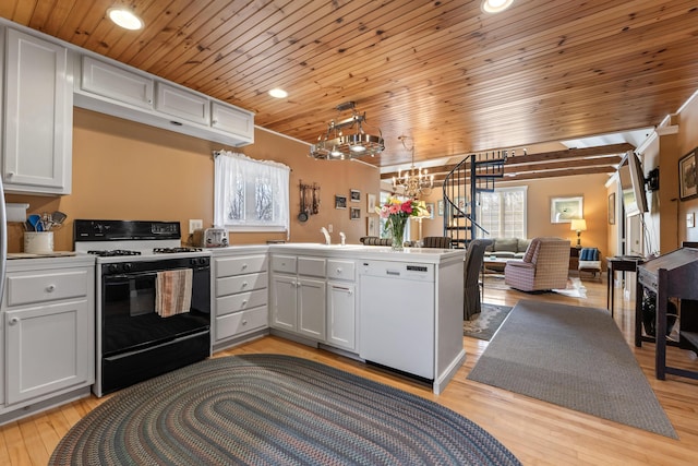 kitchen with wood ceiling, dishwasher, black gas range oven, a peninsula, and open floor plan