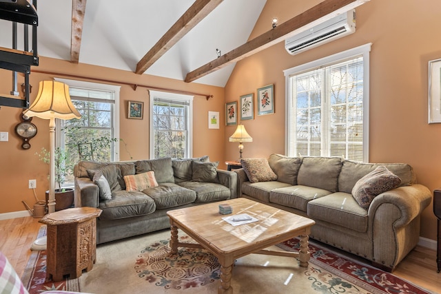 living area with beam ceiling, high vaulted ceiling, baseboards, a wall unit AC, and wood finished floors