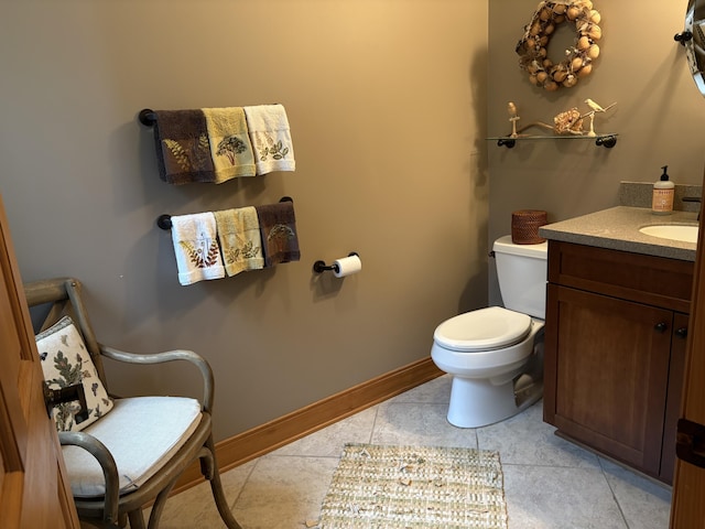 1 Mccracken Ln, Bristol, ME 04539 - bathroom with toilet, vanity, tile patterned flooring, and baseboards