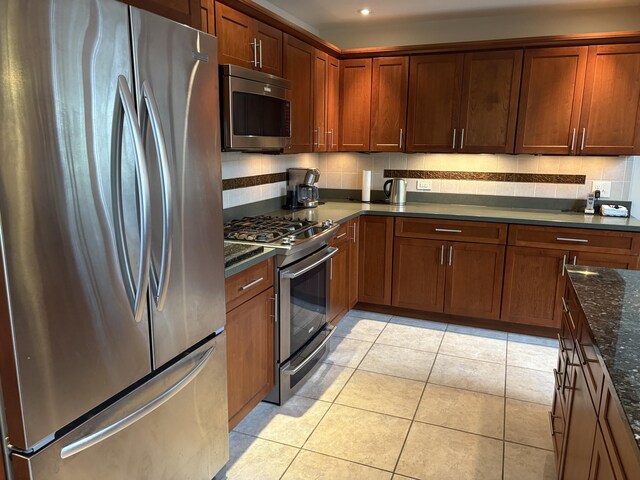 1 Mccracken Ln, Bristol, ME 04539 - kitchen featuring stainless steel appliances, light tile patterned floors, dark stone counters, and recessed lighting