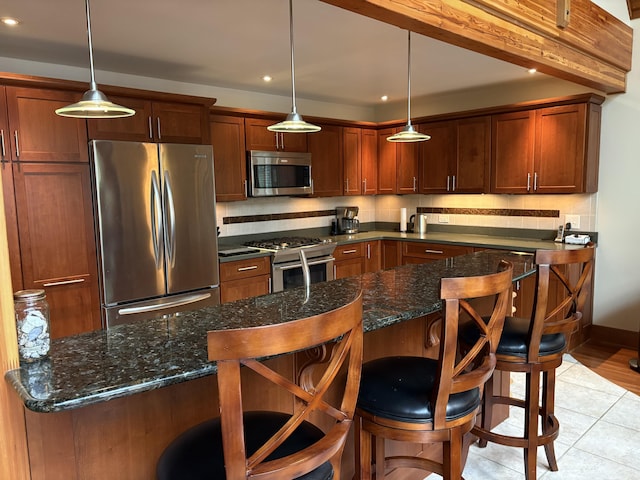 1 Mccracken Ln, Bristol, ME 04539 - kitchen with stainless steel appliances, a breakfast bar, recessed lighting, and pendant lighting