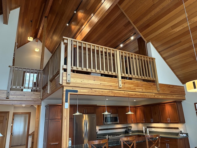 1 Mccracken Ln, Bristol, ME 04539 - kitchen with appliances with stainless steel finishes, high vaulted ceiling, dark countertops, wooden ceiling, and beam ceiling