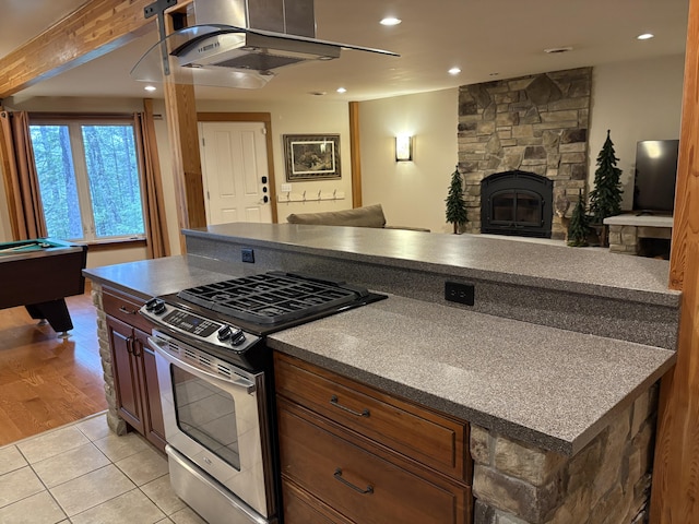 1 Mccracken Ln, Bristol, ME 04539 - kitchen with stainless steel range with gas cooktop, open floor plan, recessed lighting, light tile patterned floors, and dark countertops