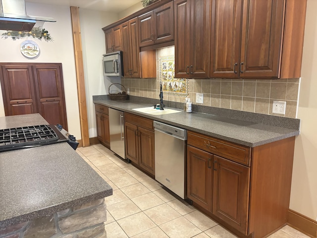 1 Mccracken Ln, Bristol, ME 04539 - kitchen with appliances with stainless steel finishes, a sink, decorative backsplash, dark countertops, and light tile patterned flooring