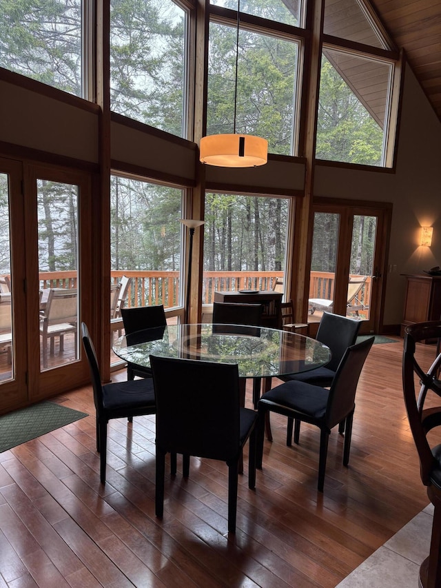 1 Mccracken Ln, Bristol, ME 04539 - dining room with a high ceiling, wood-type flooring, and plenty of natural light