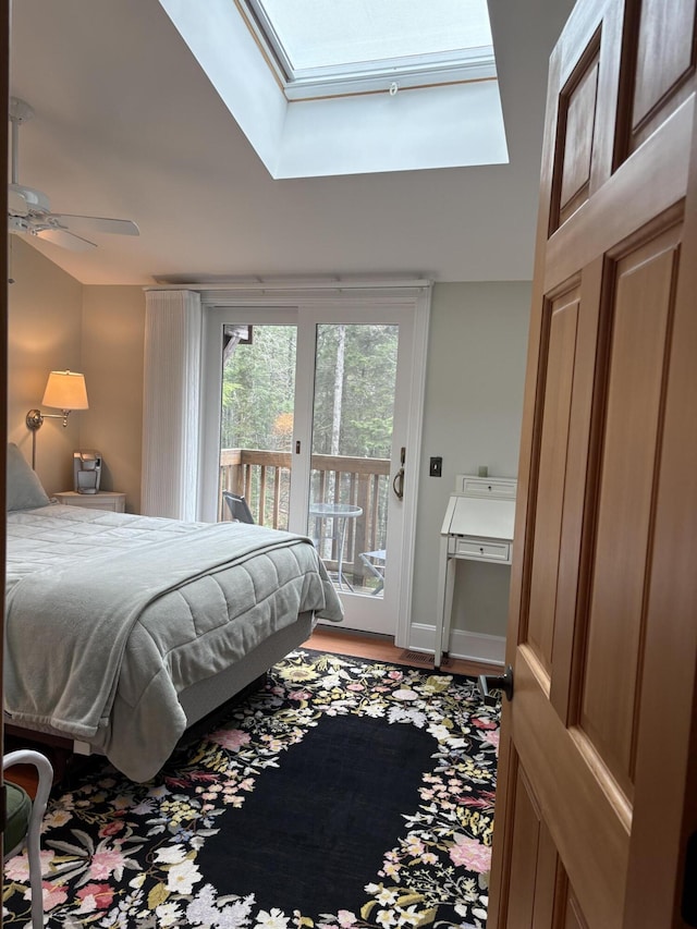 1 Mccracken Ln, Bristol, ME 04539 - bedroom featuring access to exterior, a skylight, and wood finished floors