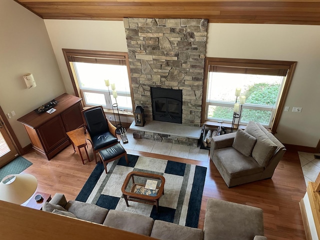 1 Mccracken Ln, Bristol, ME 04539 - living area with light wood finished floors, a fireplace, baseboards, and wooden ceiling