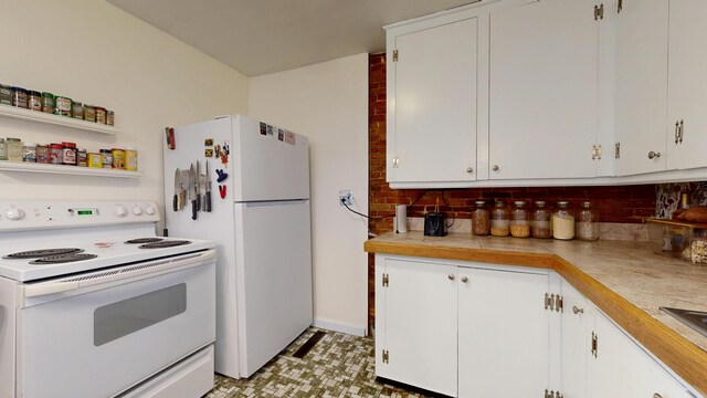 kitchen with light countertops, backsplash, and white appliances