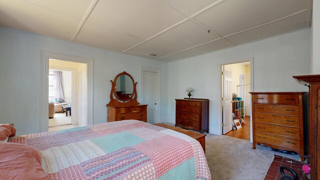 bedroom featuring visible vents and carpet