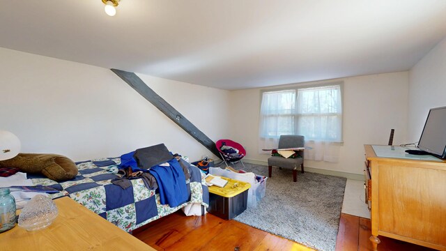 bedroom with wood finished floors