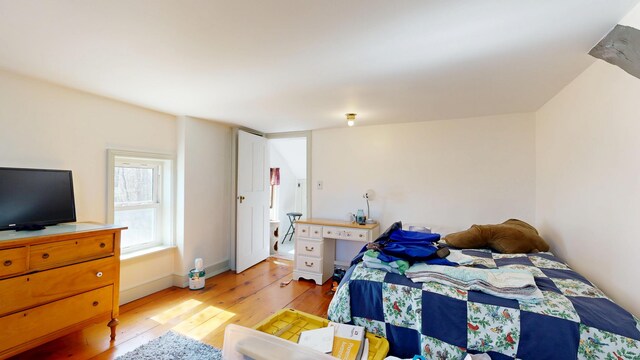 bedroom featuring light wood-style flooring