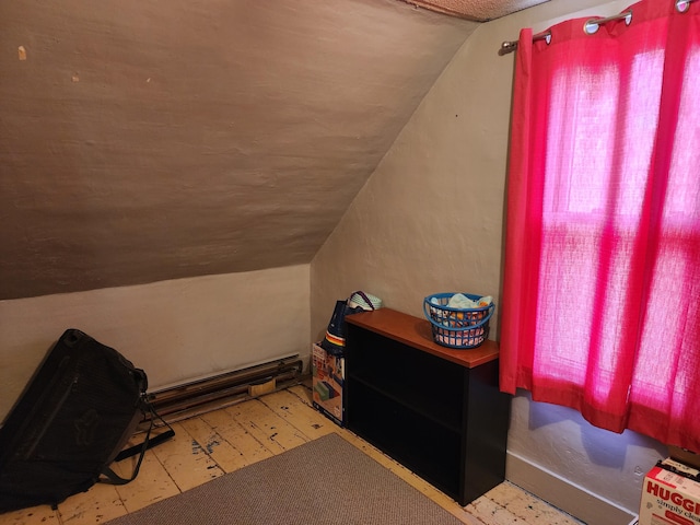 bedroom featuring tile patterned floors and lofted ceiling