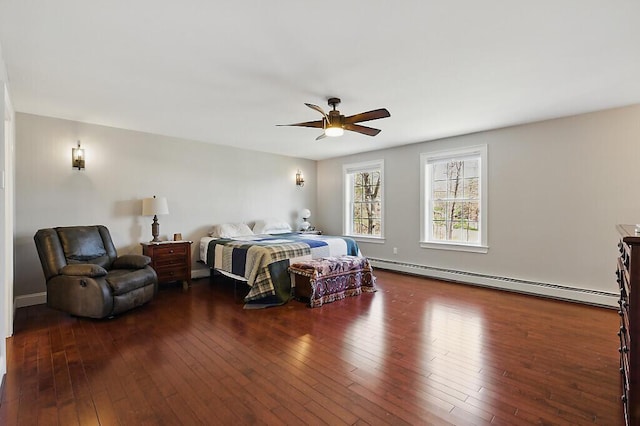 bedroom with a ceiling fan, a baseboard radiator, and dark wood-type flooring