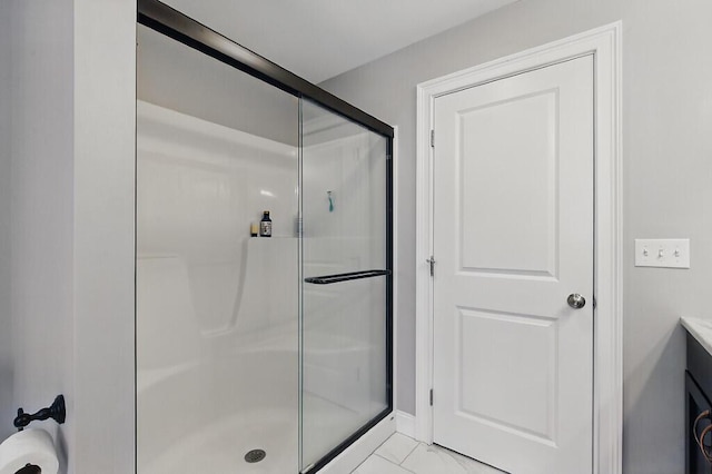 full bath featuring vanity and a shower stall