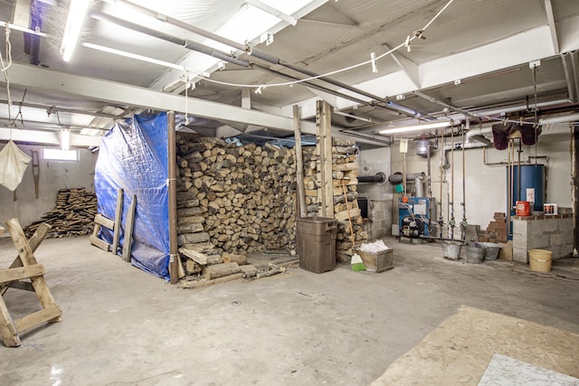 basement featuring a heating unit and gas water heater