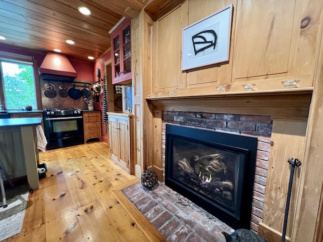 121 Jefferson St, Waldoboro, ME 04572 - living room with light wood-style flooring, wood ceiling, recessed lighting, and a fireplace