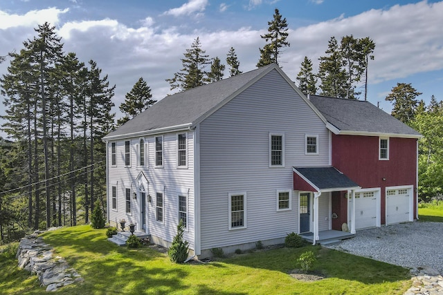 20 Campbell Rd, Southport, ME 04576 - view of front facade featuring gravel driveway, a front lawn, a shingled roof, and an attached garage