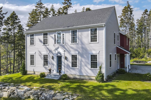 20 Campbell Rd, Southport, ME 04576 - colonial-style house with a front yard and a shingled roof