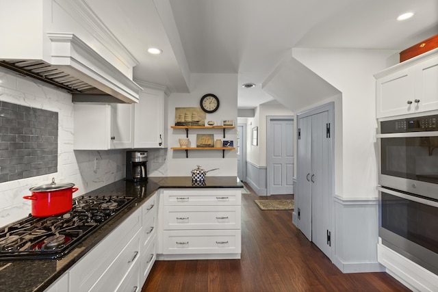 20 Campbell Rd, Southport, ME 04576 - kitchen featuring double oven, black gas cooktop, custom range hood, decorative backsplash, and white cabinetry