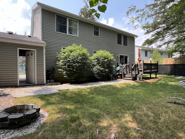 17 Fieldstone Dr, Bangor, ME 04401 - back of house featuring a wooden deck and a fire pit