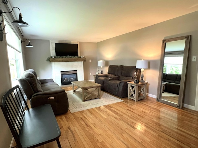 17 Fieldstone Dr, Bangor, ME 04401 - living area with light wood-type flooring and a fireplace