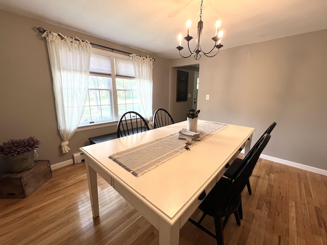 17 Fieldstone Dr, Bangor, ME 04401 - dining space with a chandelier, wood-type flooring, and baseboard heating