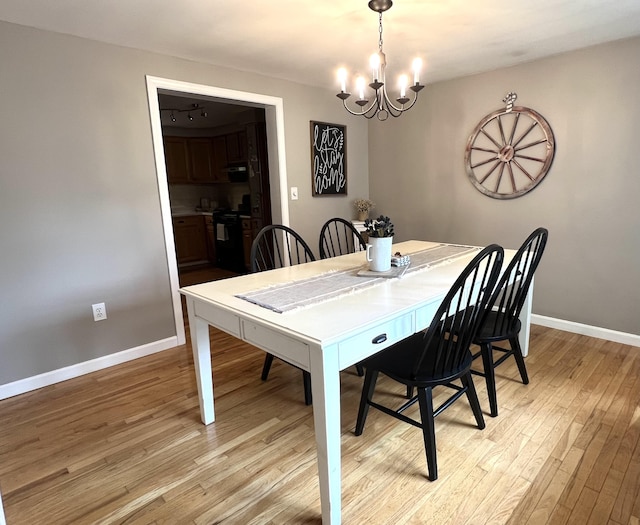 17 Fieldstone Dr, Bangor, ME 04401 - dining space featuring a chandelier and light wood-style flooring
