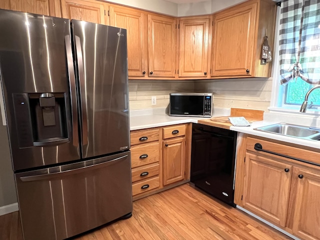 17 Fieldstone Dr, Bangor, ME 04401 - kitchen featuring appliances with stainless steel finishes, light wood finished floors, and light countertops